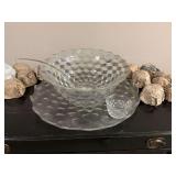 Vintage Fostoria Cubist punch bowl with underplate and 12 cups.. also included is a glass ladle… this just needs a good cleaning no damage. The under plate is 20 inches round, the punch bowl is 14�
