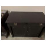 Black secretary cabinet 40” x 20” x 30” this extends into a table. It has 615 inch wide leaves that can be added to it to extend as shown.