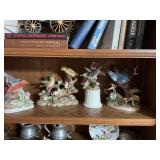Four porcelain bird figurines by Andrea.. two does have some chipping as shown