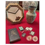 Catholic memorabilia, Mary pendant, apostle of prayer and others as shown with a 1952 copyright of I pray the Mass.. also included is a 5 1/2 x 8“ vase with a 9 1/2 inch octagon gold mirror