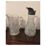 Two very pretty cut glass pitchers 11 inches and 9 inches tall