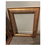 Gold picture frame measuring 22 1/2” x 26 1/2”
