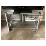 Gray and glass TV stand 41” x 22” x 25” stand only. 3 shelves