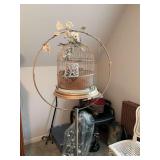 Vintage gold birdcage with stand. Birdcage is 13” x 17” the stand is 24 inches wide by 66 inches tall.