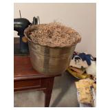 A brass pot nine and three-quarter inches by 8 inches ￼