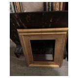 Gold frame measuring 20 x 23”