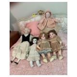 Group of five antique porcelain dolls