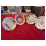 Set of four porcelain saucers
