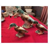 Three vintage porcelain ducks -mama duck is 12” x 9” baby ducks are  7” x 5 1/2”