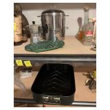 Miscellaneous kitchen ware. We have a roasting pan, a ceramic trivet, a double boiler and a little pot.