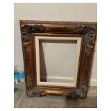 Ornate gold with cream picture frame measuring 20“ x 23“