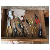 Miscellaneous tools and items in kitchen drawer