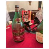 Giacobazzi  Lambrusco, 3 L bottle with wine holder and a empty Napa rose bottle used as a coin bank