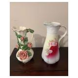 2 Pitchers. Germany porcelain floral is missing lid. 10”—-9.5” pink rose vase