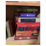 Books on bottom shelf as shown
