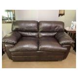 Dark brown leather loveseat, 69“ x 39“ x 36“ with the seat being 23 inches from floor.. see photos.. the white spots across front of this just needs wiped off been in outside guest house. But ha