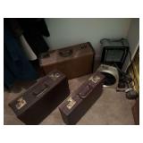 Group of luggage,  briefcase and two heaters