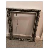Silver picture frame measuring 18“ x 22“