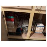 Contents of bottom double cabinet upstairs