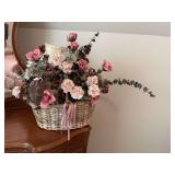 Floral arrangement in wicker basket