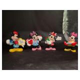Collection of (4) DISNEY ENESCO Valentine Day figurines - 3 are in original boxes and 1 is in box but box is not original to item - average height is 4”