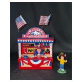 Dept. 56 porcelain Snow Village “Uncle Sam’s Fireworks Stand” in original box - 6-3/4” tall - outer sleeve has water damage but piece is in great condition - would be a great display piece for