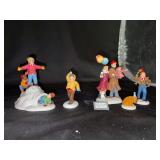 Grouping of (2) Dept. 56 The Original Snow Village porcelain figurines - 2-piece Fun In The Snow and 4-piece Happy New Year - all in original boxes