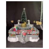 Dept. 56 porcelain Village Animated 3-piece set “Rockefeller Plaza Skating Rink - in original box - not tested