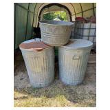 Two(2) galvanized Metal cans w/lids(1 is full of greed gourds) & a galvanized metal bucket...