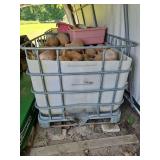 Schutz Metal IBC cage 47.5" x 39.5" x 36.5"h w/plastic liner filled with dried gourds...
