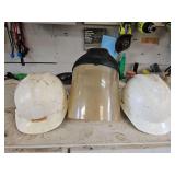 Two(2) hardhats & a face sheild...