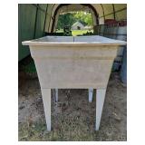 Plastic utility sink 23.75x24.75x32.5" h sink is 12" deep w/stopper NEEDS TO BE CLEANED UP...