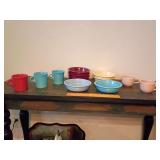 Fiesta dinnerware, all but 2 pink cups on right have lower case "f" and the 2 pink cup have single Franciscan stamp. See pics.