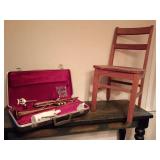 Vintage brass trumpet with hard case, music lyre, valve oil, trumpet practice mute. Childrens Kindergarten Chair.