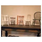 Collection of five miniature dollhouse chairs crafted from wood, showcased in diverse furniture styles. 1:12 dollhouse scale.