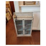 distressed wood wall cabinet with shutter doors