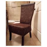 Pier 1 Brown Wicker Dining Chair features a woven dark brown rattan finish with sleek dark wood legs and a high-backed silhouette. Back height 62.5", seat height 18.25", 19"W, 24"D.