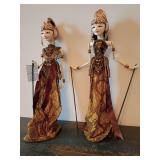 Traditional Indonesian Wayang Golek puppets, which are hand-carved wooden rod puppets originating from the Sundaness culture of West Java, Indonesia. 22" L, his left hand control stick is missing.