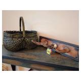 Green/black buttocks basket 14.5" T x 15" W, and a rustic, wall-mounted steer horn coat rack 20.25" L x 8.5" D.