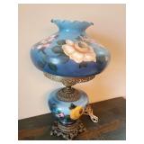 Gone with the Wind" style lamp with a hand-painted blue floral milk glass shade and base. Base has come off bottom. Untested. 24" T x approx. 14" W at top. Just found 14" hurricane globe for vintage l