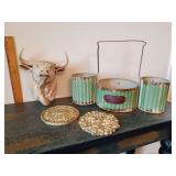 Collection of rustic and farmhouse-style decor items, including a trio of green corrugated metal caddy pots, a decorative animal wall mount, and ornamental floral wall plaques.