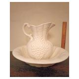 White ceramic pitcher and basin set.