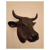 Black bull head wall decor. Chip on back of left ear.
