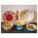 Mix of vibrant, hand-painted ceramic dinnerware patterns.