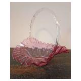 Fenton Cranberry Glass Ruffled Basket with an applied clear twisted glass handle.