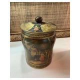 5 1/2 x 7“ Vintage covered Tin with scene.