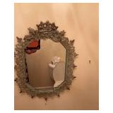Very unique vintage metal crown and floral mirror. 17” x 22”.