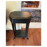 Black with gold footed crackled table 17“ x 12“ x 26 1/2“ does have some chipping as shown