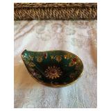 Green jeweled bohemian with gold trivet