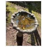 Concrete birdbath. The bowl is 23 inches round, the birdbathsrands 31 inches tall